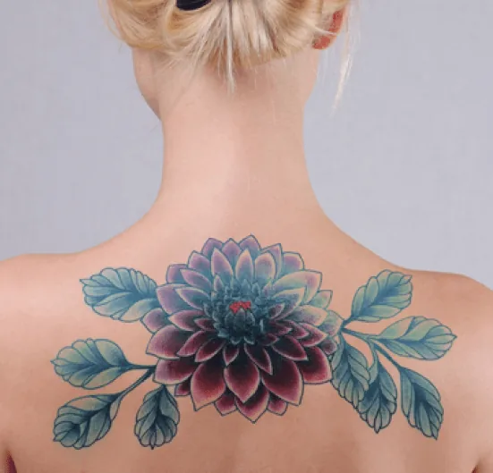 Large blue and teal floral back piece tattoo
